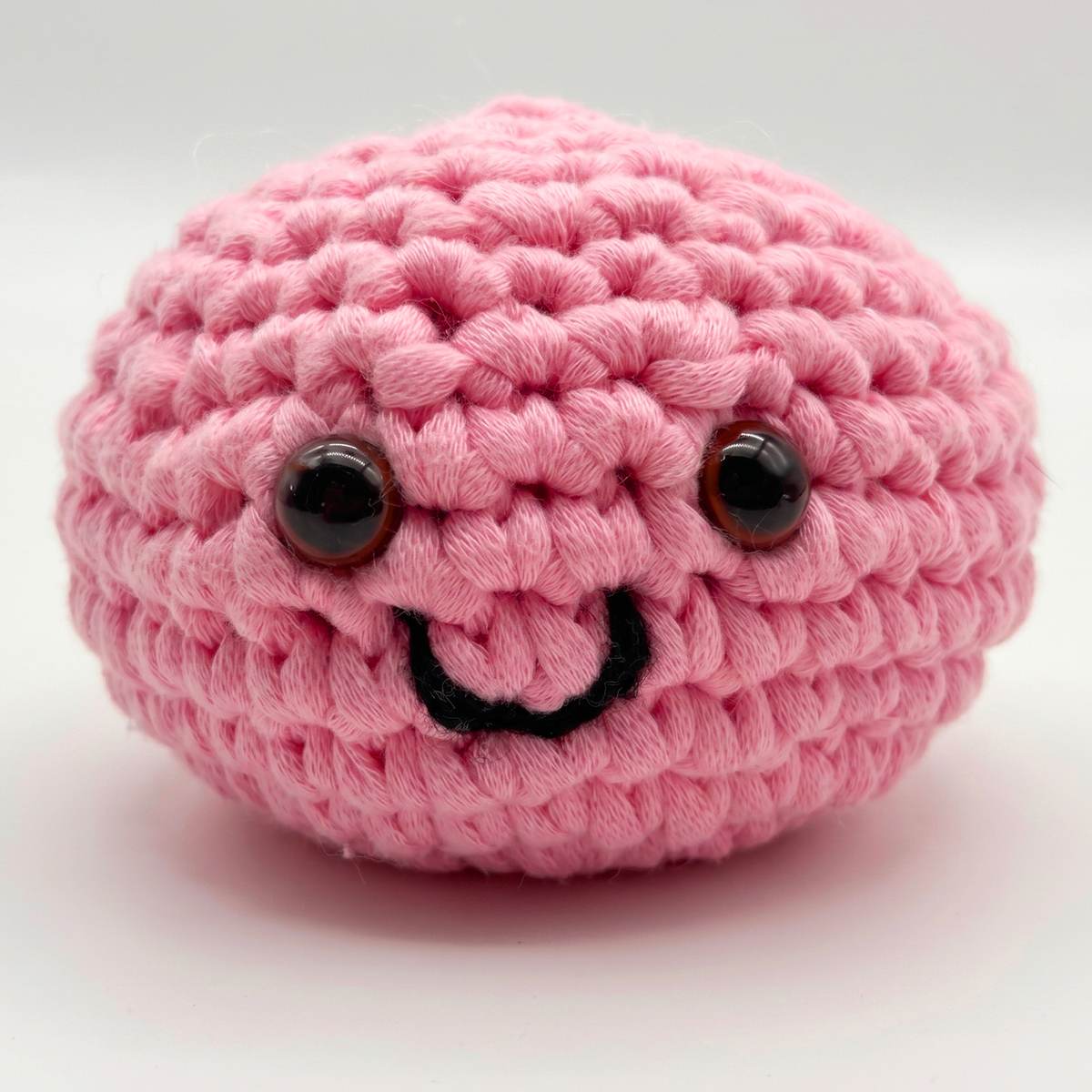 Close view of a crocheted dumpling's stitches